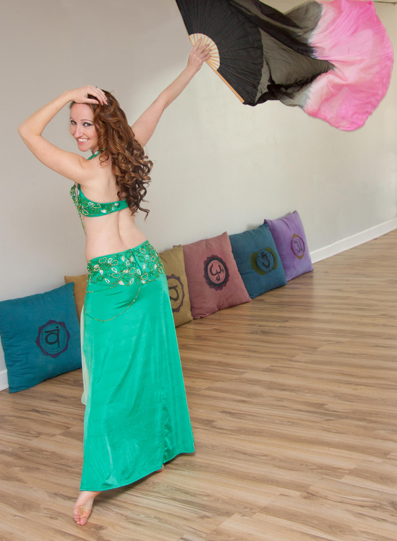 Donna performing with a fan veil